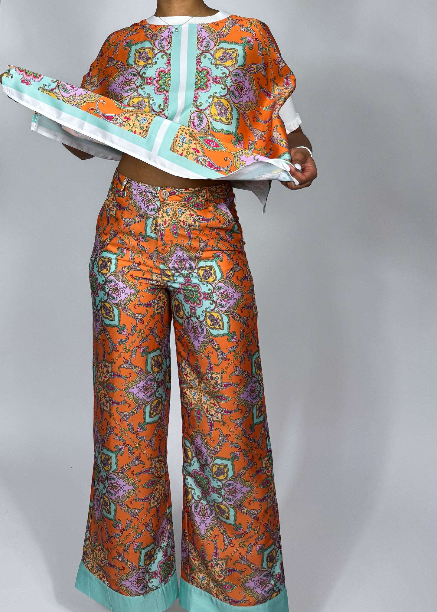 Stylish vacation-ready outfit
Effortless brunch look
Comfortable yet trendy lounge set
Summer travel fashion essentials
Casual glam statement outfit
Vibrant orange & mint contrast
Lightweight, breezy fabric
Oversized relaxed blouse
Wide-leg palazzo pants
Intricate paisley print
Luxe silk print matching set
Elegant paisley print co-ord
Statement wide-leg pants & top
Bohemian luxe two-piece outfit
Chic flowy resort wear