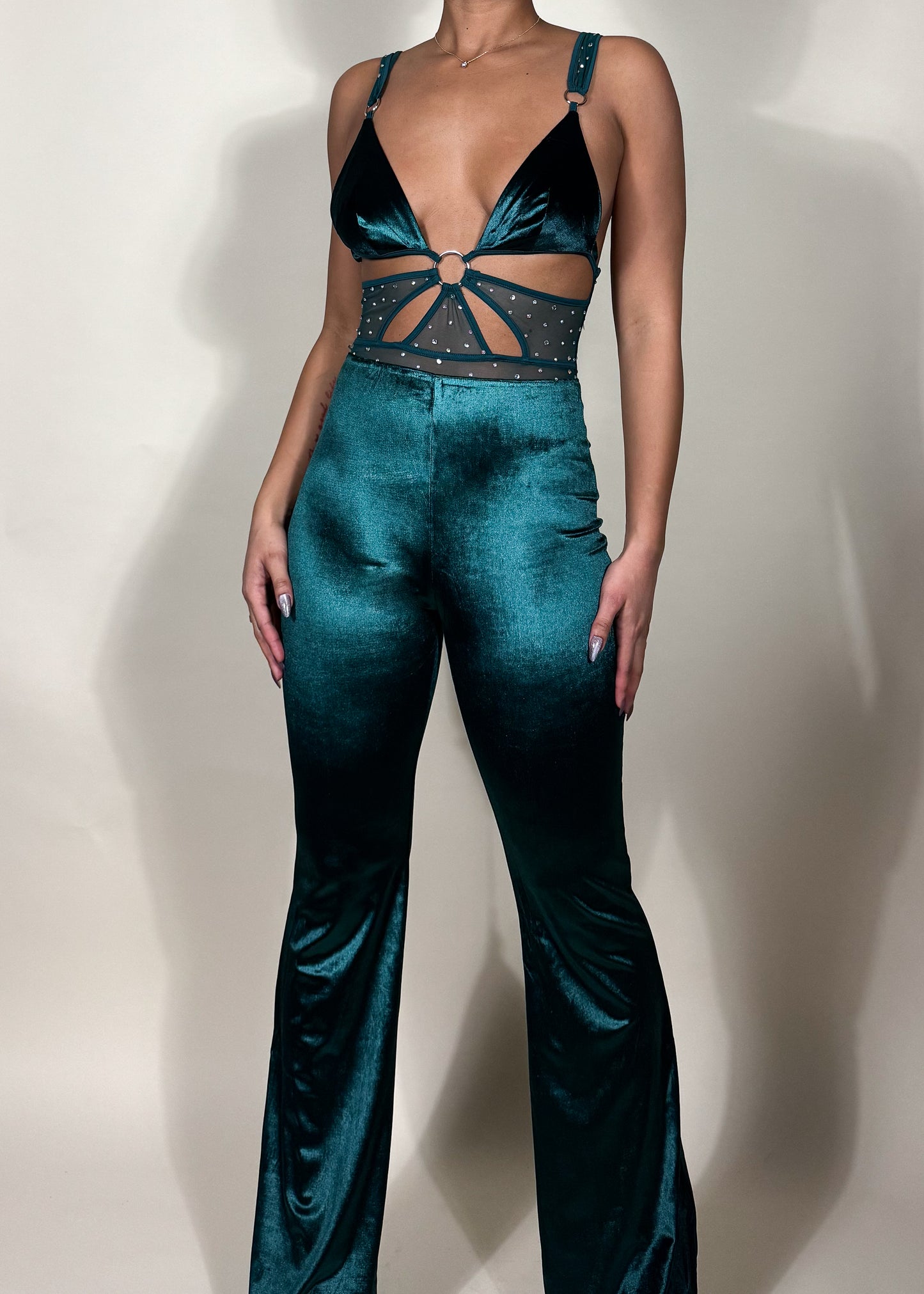 Night-out fashion inspiration
Statement-making clubwear
Holiday party outfit idea
Trendy date night look
 glam style
Soft velvet high-waisted pants
Strappy cutout top with embellishments
High-shine velvet fabric
Chic and sleek evening wear
Flared pants with a modern touch
Teal velvet two-piece set
Glamorous party outfit
Trendy matching set for women
Luxe velvet fashion
Elegant festival outfit