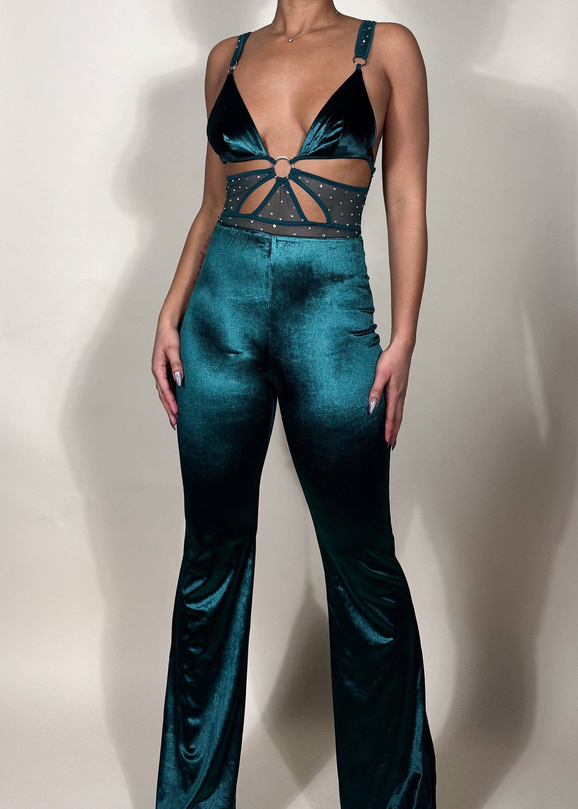 Night-out fashion inspiration
Statement-making clubwear
Holiday party outfit idea
Trendy date night look
 glam style
Soft velvet high-waisted pants
Strappy cutout top with embellishments
High-shine velvet fabric
Chic and sleek evening wear
Flared pants with a modern touch
Teal velvet two-piece set
Glamorous party outfit
Trendy matching set for women
Luxe velvet fashion
Elegant festival outfit