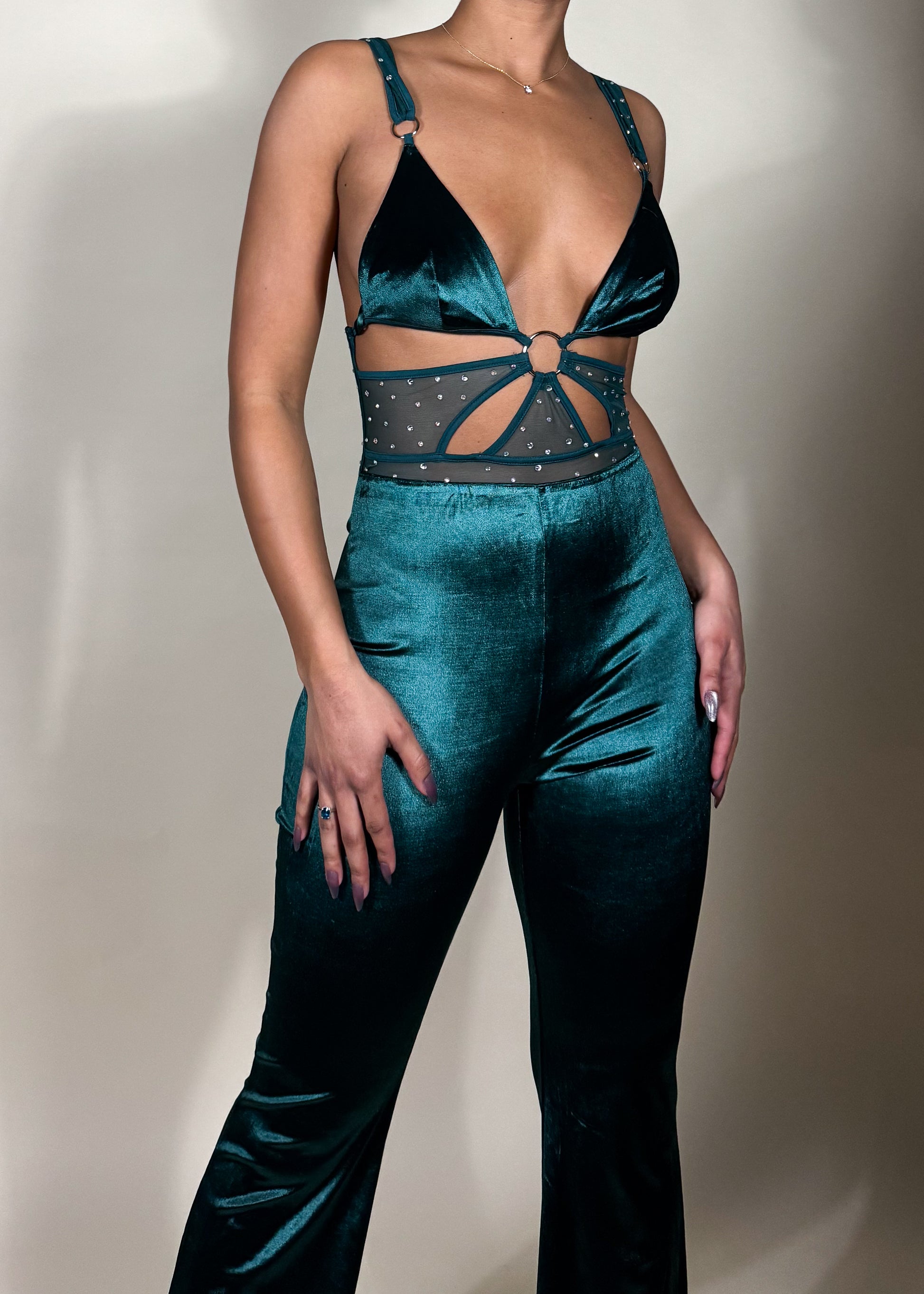 Night-out fashion inspiration
Statement-making clubwear
Holiday party outfit idea
Trendy date night look
 glam style
Soft velvet high-waisted pants
Strappy cutout top with embellishments
High-shine velvet fabric
Chic and sleek evening wear
Flared pants with a modern touch
Teal velvet two-piece set
Glamorous party outfit
Trendy matching set for women
Luxe velvet fashion
Elegant festival outfit