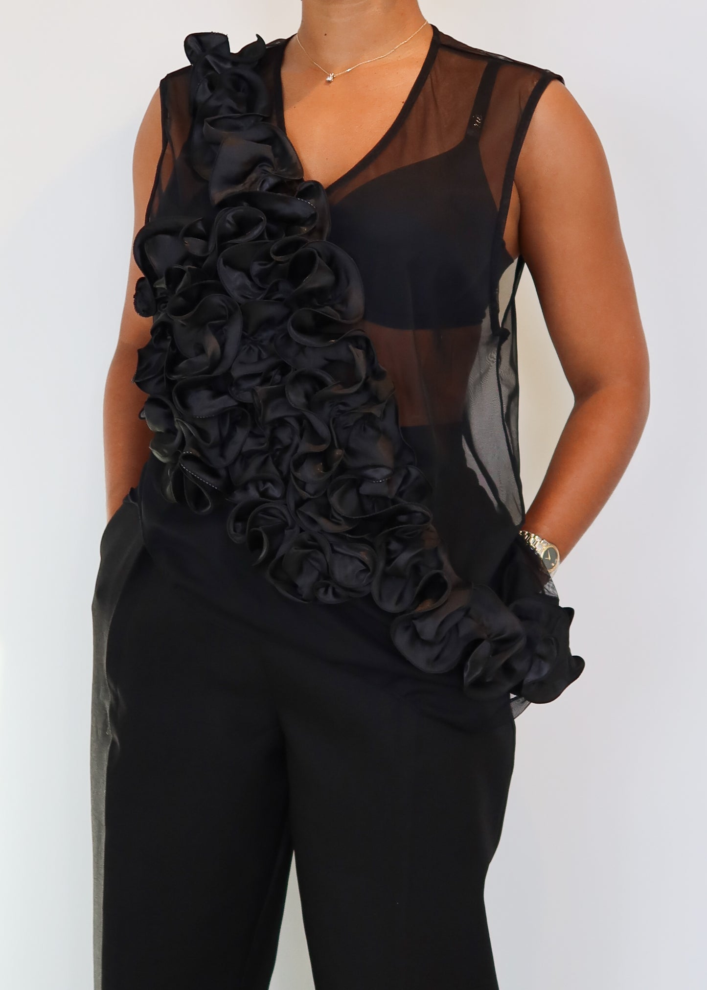 Elegant evening wear
Cocktail party outfit
Gala fashion statement
Red carpet look
Fashion-forward dinner outfit
High-fashion event outfit
Date night attire
Statement top for special occasions
Sheer mesh top
Asymmetrical ruffle detail
Layered floral ruffles
Sleeveless sheer blouse
Sculptural fashion piece
High-fashion avant-garde design
Dramatic statement top
Unique draped silhouette
Bold and sophisticated
High-fashion editorial look
Couture-inspired outfit
Modern glamour
Edgy yet elegant
Statement evening