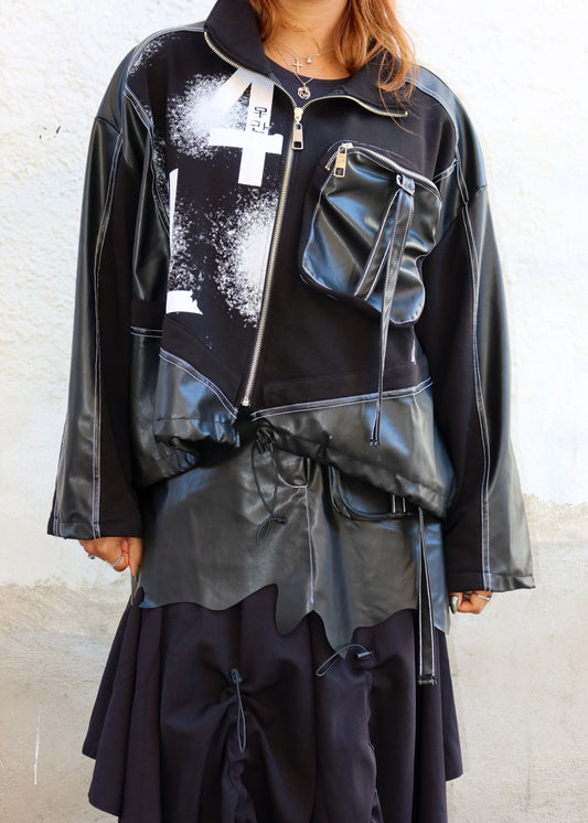 Streetwear fashion
Urban casual outfit
High-fashion street style
Fall/Winter edgy outfit
Concert or festival look
Avant-garde statement piece
Fashion week outfit
Trendy outerwear for layering
Edgy everyday style
Creative fashion aesthetic
Black oversized jacket
Graphic print outerwear
Leather and fabric mix jacket
Utility pocket design
Asymmetrical fashion piece
Bold zip-up jacket
Streetwear bomber jacket
Multi-textured jacket
High-fashion utility outerwear
Distressed graphic design
Edgy and bold fashion