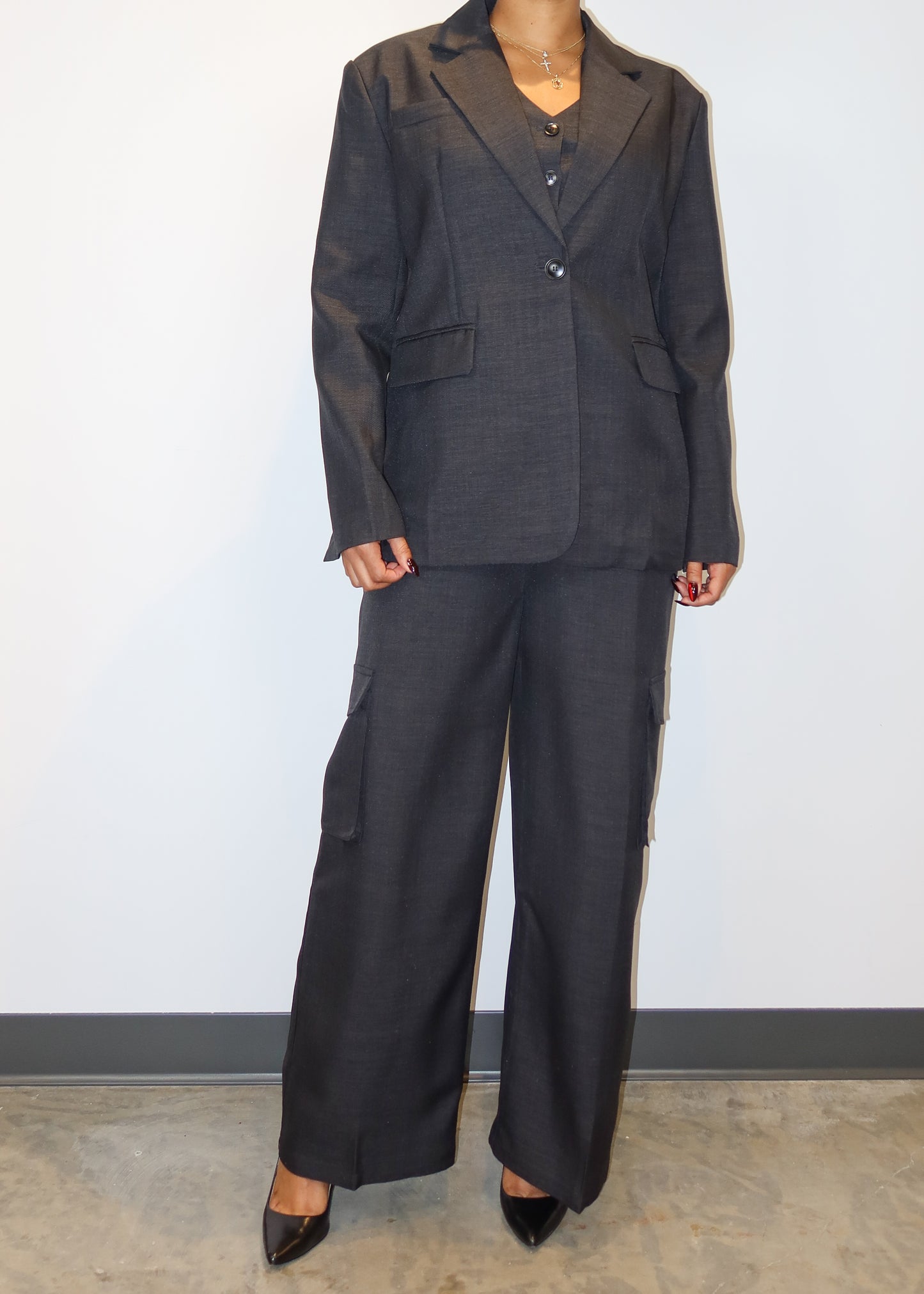 Power dressing for women
Professional workwear outfit
Business formal attire
Boss lady fashion
Corporate chic look
Executive office wear
Smart casual work outfit
Elegant boardroom attire
Stylish job interview suit
High-fashion businesswear
Three-piece women’s suit
Tailored waistcoat set
Wide-leg suit pants
Structured blazer outfit
Cargo pocket trousers
Minimalist black vest suit
Oversized blazer trend
Menswear-inspired fashion
Modern utility suit
Timeless tailored ensemble
Sleek and sophisticated
Confident
