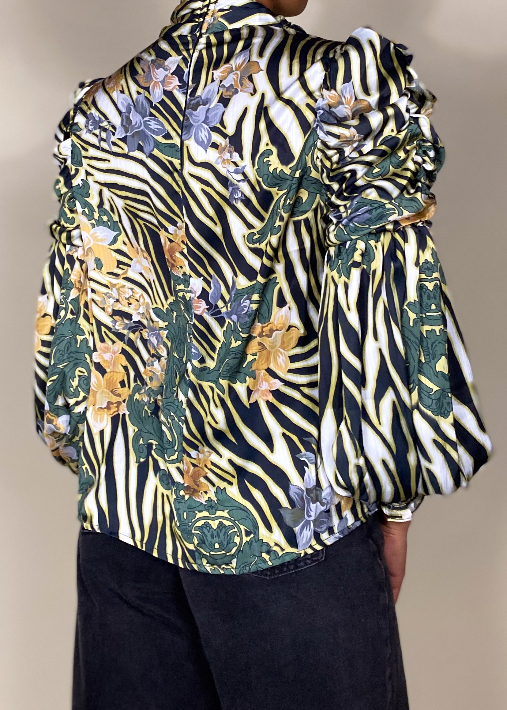 Workwear blouse
Business casual top
Evening dinner outfit
Special occasion blouse
Elegant office wear
Formal event fashion
Statement blouse for parties
High-neck puff sleeve blouse
Abstract print top
Ruffle detail blouse
Baroque-inspired fashion
Vintage chic blouse
Flowing long sleeve top
Dramatic statement blouse
Bold and sophisticated
Artistic and trendy
Vintage elegance
Modern bohemian fashion
Luxe and stylish
Feminine yet powerful
High-fashion blouse