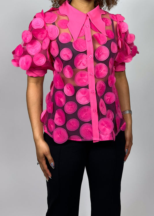 Head-turning fashion week outfit
Standout brunch or dinner look
Unique art-inspired event wear
Statement top for fashion influencers
Playful yet chic date night outfit
Hot pink circular appliqué design
Sheer fabric with bold texture
Oversized pointed collar trend
Playful yet structured blouse
Designer-inspired artistic top
Avant-garde pink sheer blouse
Statement 3D appliqué top
Bold contemporary fashion
Artistic high-fashion blouse
Trendy puff sleeve sheer shirt
