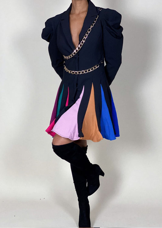 Standout cocktail party outfit
High-fashion runway-inspired look
Evening wear with a contemporary twist
Eye-catching designer-style mini dress
Power dressing with a modern edge
Puff sleeve blazer mini dress
Pleated multicolor contrast skirt
Chic chain belt detailing
Feminine meets edgy structured dress
statement piece
Edgy blazer dress with color-blocking
Modern power dress with gold chains
Unique asymmetrical mini dress
Bold structured blazer-inspired dress
Trendy fashion-forward statement dress