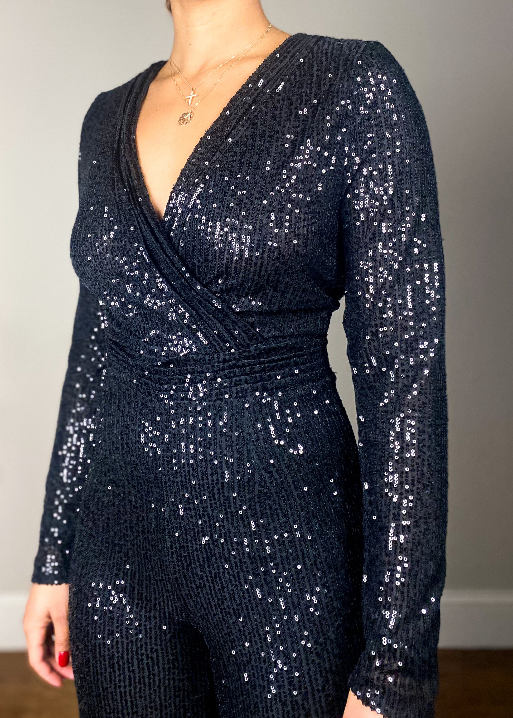 Holiday party outfit idea
Red carpet-ready jumpsuit
New Year's Eve outfit inspiration
Show-stopping clubwear jumpsuit
Luxe date night look
Stretch fabric sequin jumpsuit
Figure-hugging sequin romper
Soft mesh lining for comfort
Wide-leg glitter jumpsuit
Lightweight shimmer jumpsuit
Black sequin jumpsuit
Sparkly evening jumpsuit
Elegant long-sleeve jumpsuit
V-neck embellished jumpsuit
Chic all-black party outfit