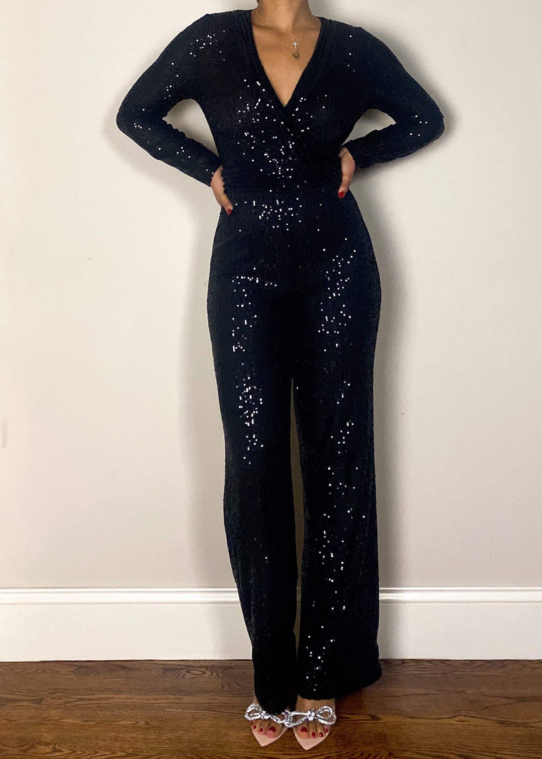 Holiday party outfit idea
Red carpet-ready jumpsuit
New Year's Eve outfit inspiration
Show-stopping clubwear jumpsuit
Luxe date night look
Stretch fabric sequin jumpsuit
Figure-hugging sequin romper
Soft mesh lining for comfort
Wide-leg glitter jumpsuit
Lightweight shimmer jumpsuit
Black sequin jumpsuit
Sparkly evening jumpsuit
Elegant long-sleeve jumpsuit
V-neck embellished jumpsuit
Chic all-black party outfit