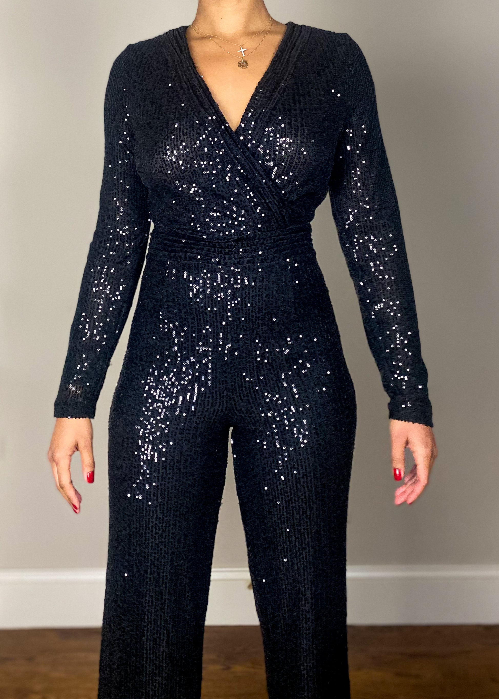 Holiday party outfit idea
Red carpet-ready jumpsuit
New Year's Eve outfit inspiration
Show-stopping clubwear jumpsuit
Luxe date night look
Stretch fabric sequin jumpsuit
Figure-hugging sequin romper
Soft mesh lining for comfort
Wide-leg glitter jumpsuit
Lightweight shimmer jumpsuit
Black sequin jumpsuit
Sparkly evening jumpsuit
Elegant long-sleeve jumpsuit
V-neck embellished jumpsuit
Chic all-black party outfit