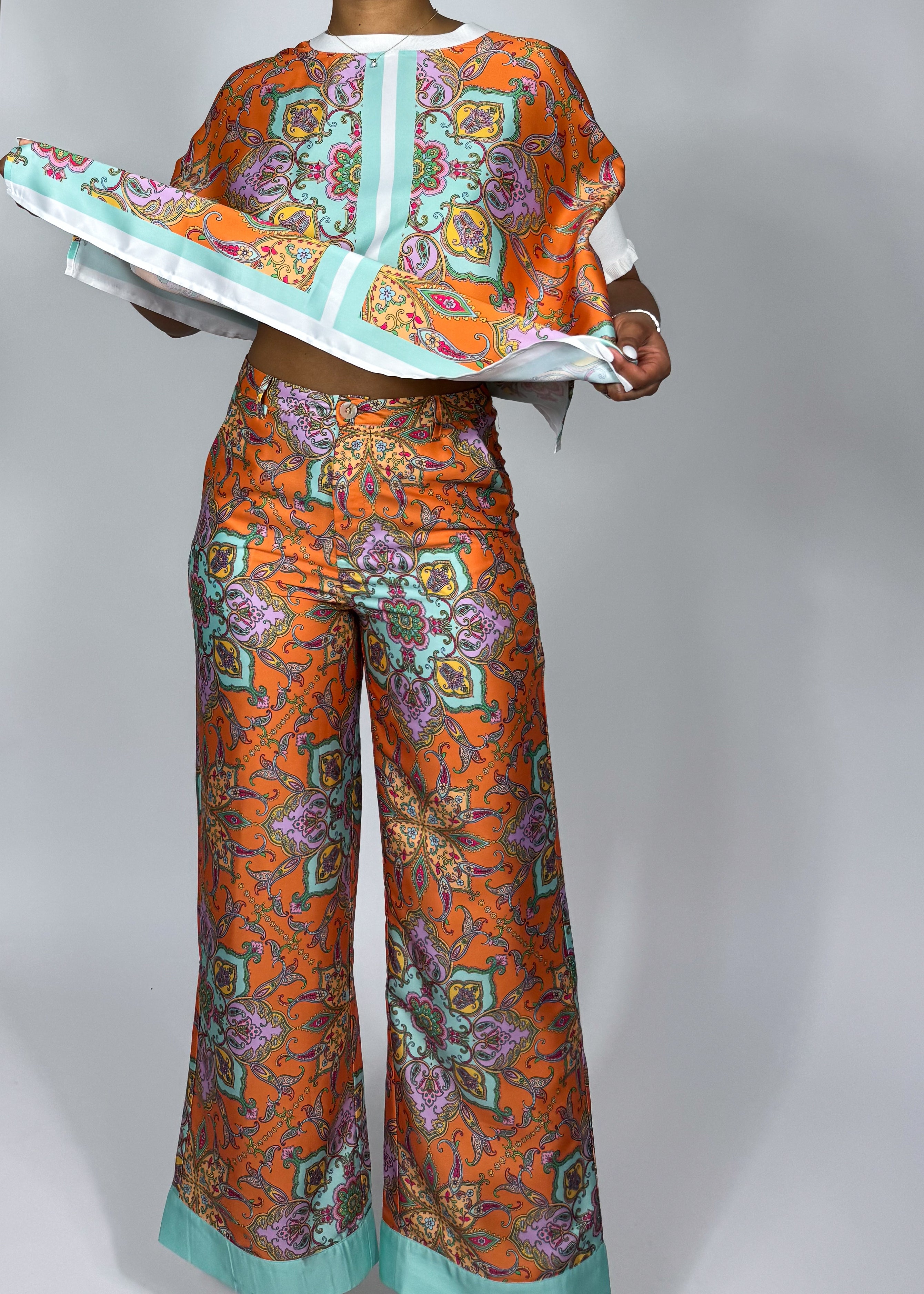 Stylish vacation-ready outfit
Effortless brunch look
Comfortable yet trendy lounge set
Summer travel fashion essentials
Casual glam statement outfit
Vibrant orange & mint contrast
Lightweight, breezy fabric
Oversized relaxed blouse
Wide-leg palazzo pants
Intricate paisley print
Luxe silk print matching set
Elegant paisley print co-ord
Statement wide-leg pants & top
Bohemian luxe two-piece outfit
Chic flowy resort wear