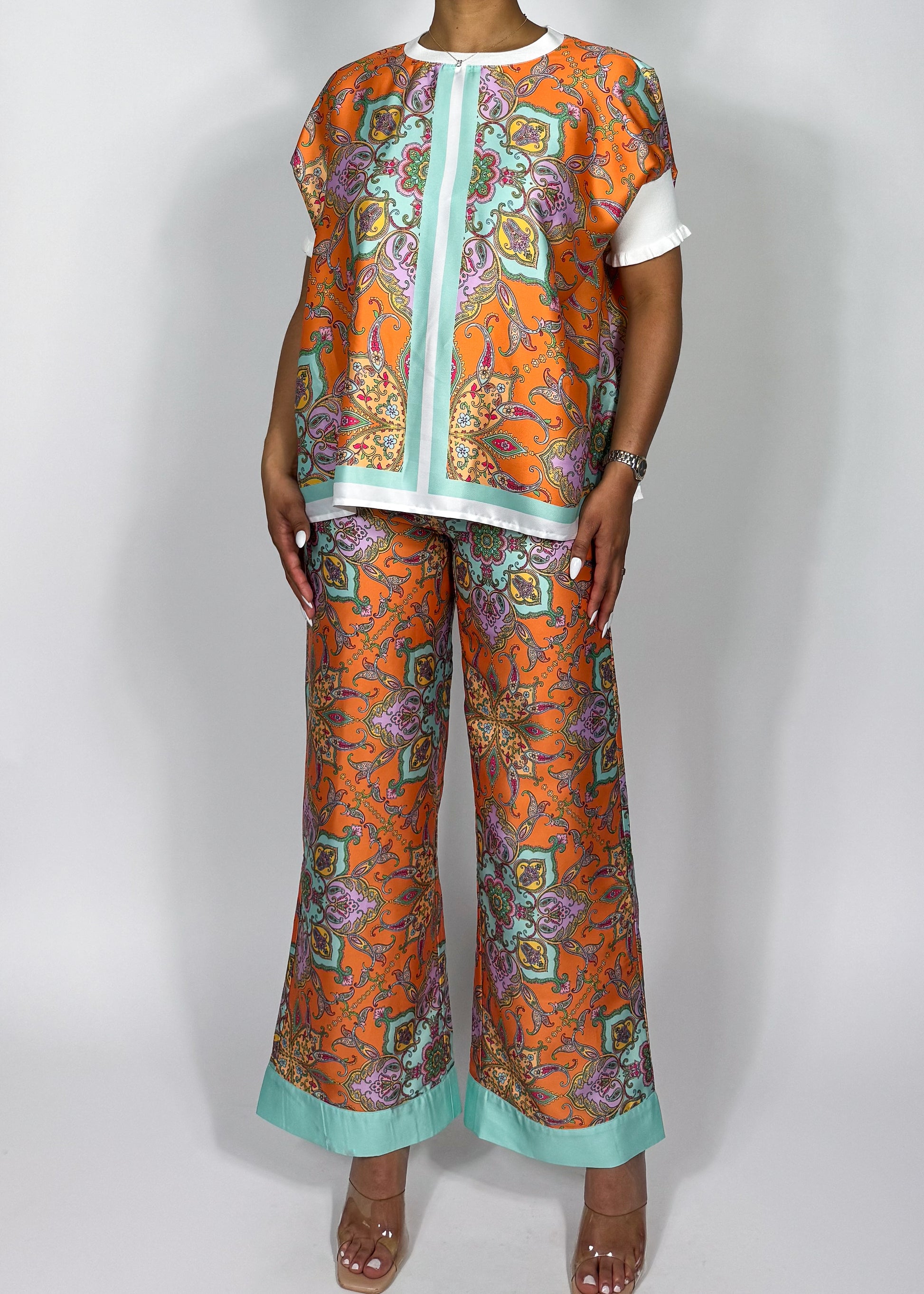 Stylish vacation-ready outfit
Effortless brunch look
Comfortable yet trendy lounge set
Summer travel fashion essentials
Casual glam statement outfit
Vibrant orange & mint contrast
Lightweight, breezy fabric
Oversized relaxed blouse
Wide-leg palazzo pants
Intricate paisley print
Luxe silk print matching set
Elegant paisley print co-ord
Statement wide-leg pants & top
Bohemian luxe two-piece outfit
Chic flowy resort wear