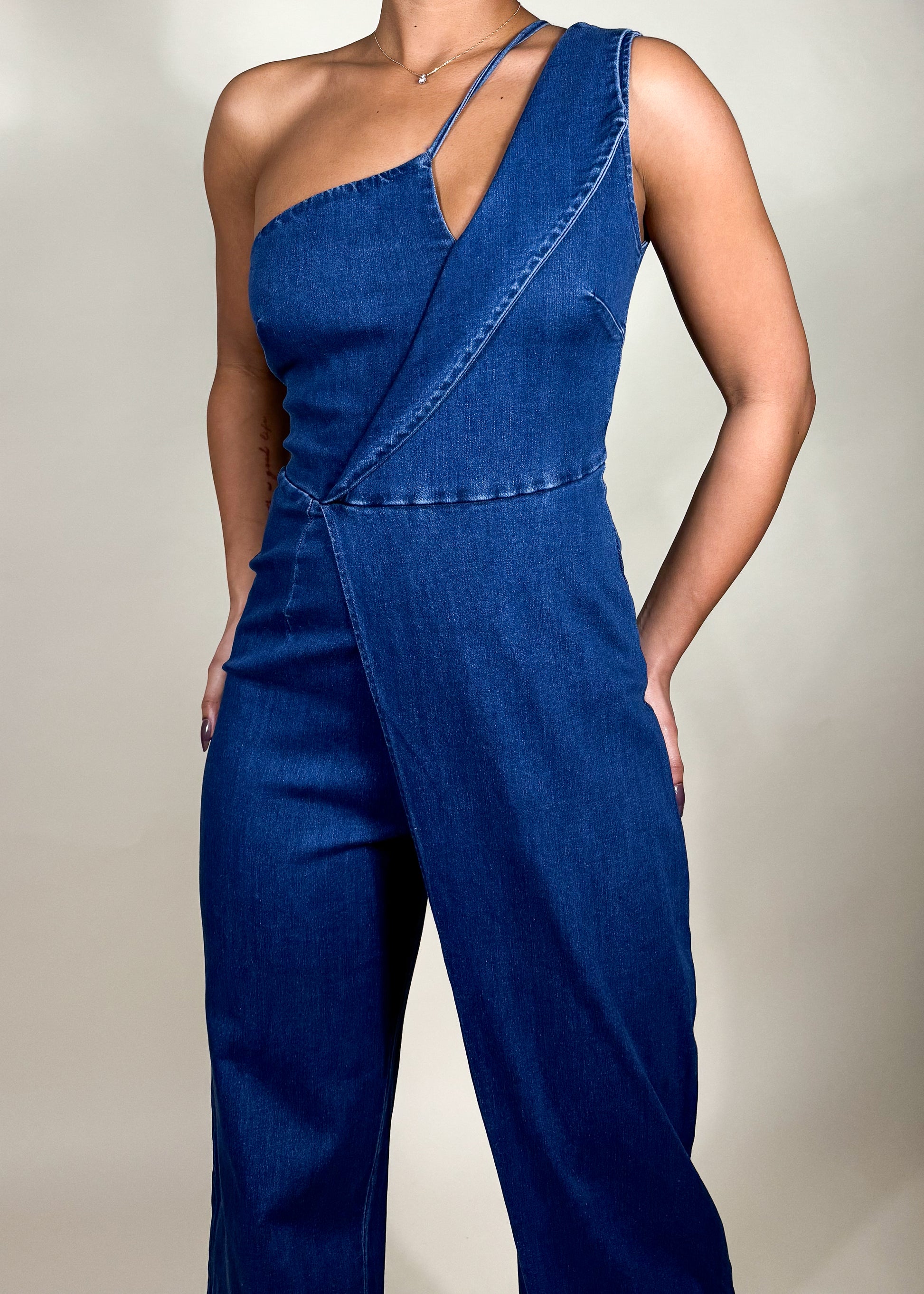 Casual chic outfit
Denim fashion statement
Trendy brunch outfit
Street style denim look
Night out fashion
Summer/fall fashion piece
Concert or festival outfit
Weekend casual wear
Fashion-forward event look
Contemporary casual wear
One-shoulder denim jumpsuit
Asymmetrical denim design
Modern denim romper
Statement wide-leg jumpsuit
Dark wash denim outfit
Tailored denim one-piece
Sleek and structured jumpsuit
Minimalist denim fashion
Unique cutout denim outfit
High-fashion denim wear
Chic and modern aesthetic