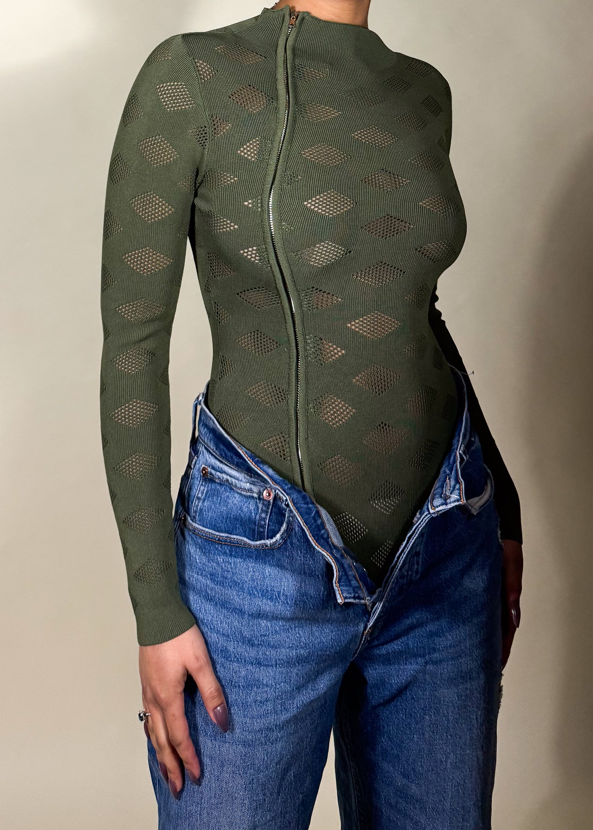 Night out clubwear bodysuit
Elevated casual fashion look
Perfect for trendy street style
Stylish fall & winter layering piece
High-fashion urban wear
Diamond mesh pattern bodysuit
Body-hugging sculpted fit
Zipper-front closure bodysuit
Long-sleeve see-through top
Modern, sleek high-neck bodysuit
Edgy sheer long-sleeve bodysuit
Olive green fitted mesh bodysuit
Statement zipper front top
Streetwear-inspired bodysuit
Chic and bold layering piece