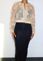 Elegant evening jacket
Formal event outerwear
Wedding guest cover-up
Gala or red carpet outfit
Luxury dinner party attire
Mother of the bride jacket
Special occasion layering piece
Statement jacket for high-end events
Sheer embroidered jacket
Beaded floral embellishments
Luxury couture bolero
Handcrafted detailing
Lightweight formal cover-up
Beaded and sequin appliqué
Delicate sheer fabric
Elegant cropped jacket
Vintage-inspired elegance
Romantic and feminine
Timeless couture fashion
Chic and sophisticated