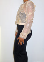 Elegant evening jacket
Formal event outerwear
Wedding guest cover-up
Gala or red carpet outfit
Luxury dinner party attire
Mother of the bride jacket
Special occasion layering piece
Statement jacket for high-end events
Sheer embroidered jacket
Beaded floral embellishments
Luxury couture bolero
Handcrafted detailing
Lightweight formal cover-up
Beaded and sequin appliqué
Delicate sheer fabric
Elegant cropped jacket
Vintage-inspired elegance
Romantic and feminine
Timeless couture fashion
Chic and sophisticated