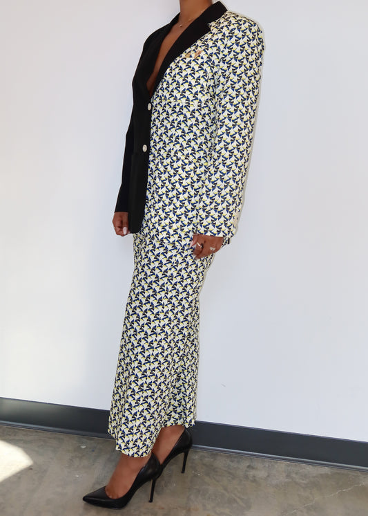 Statement office wear
Business casual power suit
Elegant workwear outfit
Fashion-forward formal set
Chic semi-formal attire
Unique evening wear
Trendy professional outfit
Two-tone blazer and pants set
Printed contrast suit
Asymmetrical pattern pantsuit
Statement patchwork blazer
Abstract print fashion set
Button-up blazer with wide-leg pants