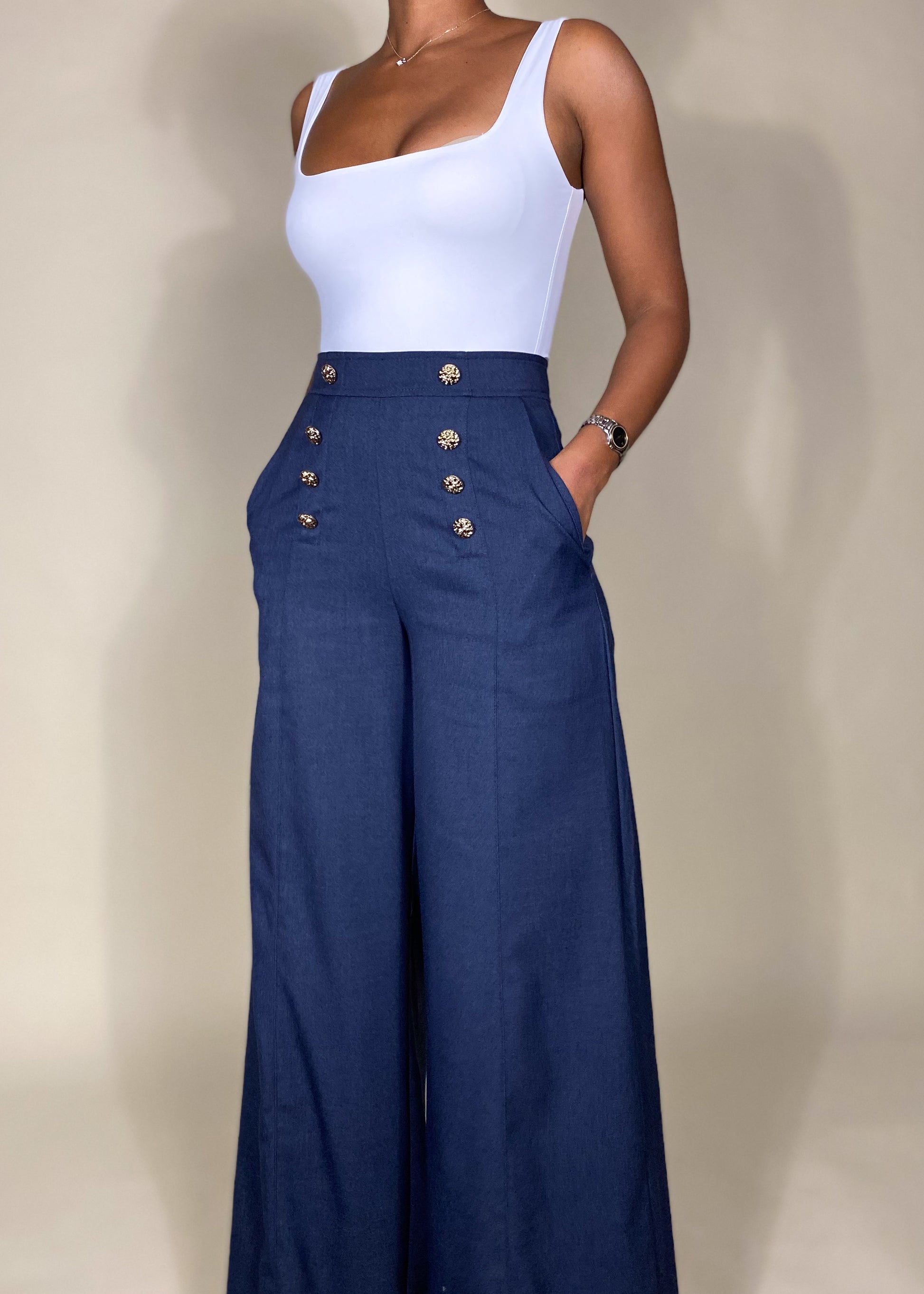 Business casual trousers
Office wear wide-leg pants
Elegant formal pants
Chic everyday workwear
Brunch outfit idea
Classy date night trousers
High-waisted sailor pants
Wide-leg button detail trousers
Tailored structured pants
Nautical-inspired fashion
Statement gold button trousers
Vintage-inspired high-rise pants
Sophisticated modern fashion
Elegant minimalist outfit
Parisian chic aesthetic
Classic retro-inspired pants
Polished timeless fashion
Power dressing ensemble