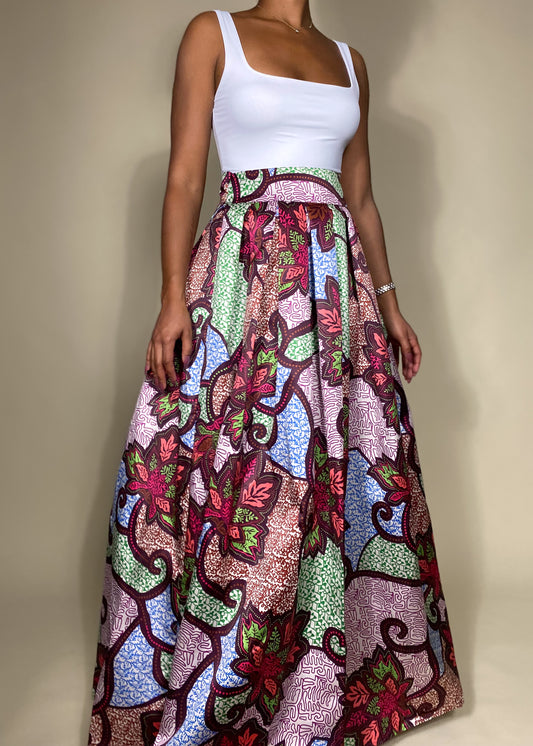 Elegant summer outfit
Cultural celebration attire
Vibrant festival fashion
Wedding guest outfit idea
Chic vacation look
Brunch date outfit
Statement evening wear
Formal yet stylish ensemble
Bohemian-inspired fashion
event outfit
Ankara print fashion
High-waisted flared skirt
Colorful wax print fabric
Ethnic-inspired apparel
Flowing silhouette design
Bold floral print skirt
Boho-glam statement look
Contemporary ethnic wear
Elegant yet bold outfit
Artistic and unique fashion
Effortlessly sophisticated
Classy 