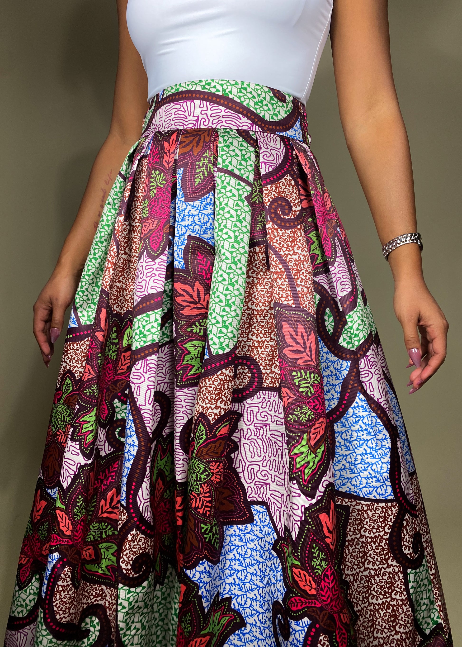 elegant summer outfit
Cultural celebration attire
Vibrant festival fashion
Wedding guest outfit idea
Chic vacation look
Brunch date outfit
Statement evening wear
Formal yet stylish ensemble
Bohemian-inspired fashion
event outfit
Ankara print fashion
High-waisted flared skirt
Colorful wax print fabric
Ethnic-inspired apparel
Flowing silhouette design
Bold floral print skirt
Boho-glam statement look
Contemporary ethnic wear
Elegant yet bold outfit
Artistic and unique fashion
Effortlessly sophisticated
Classy 