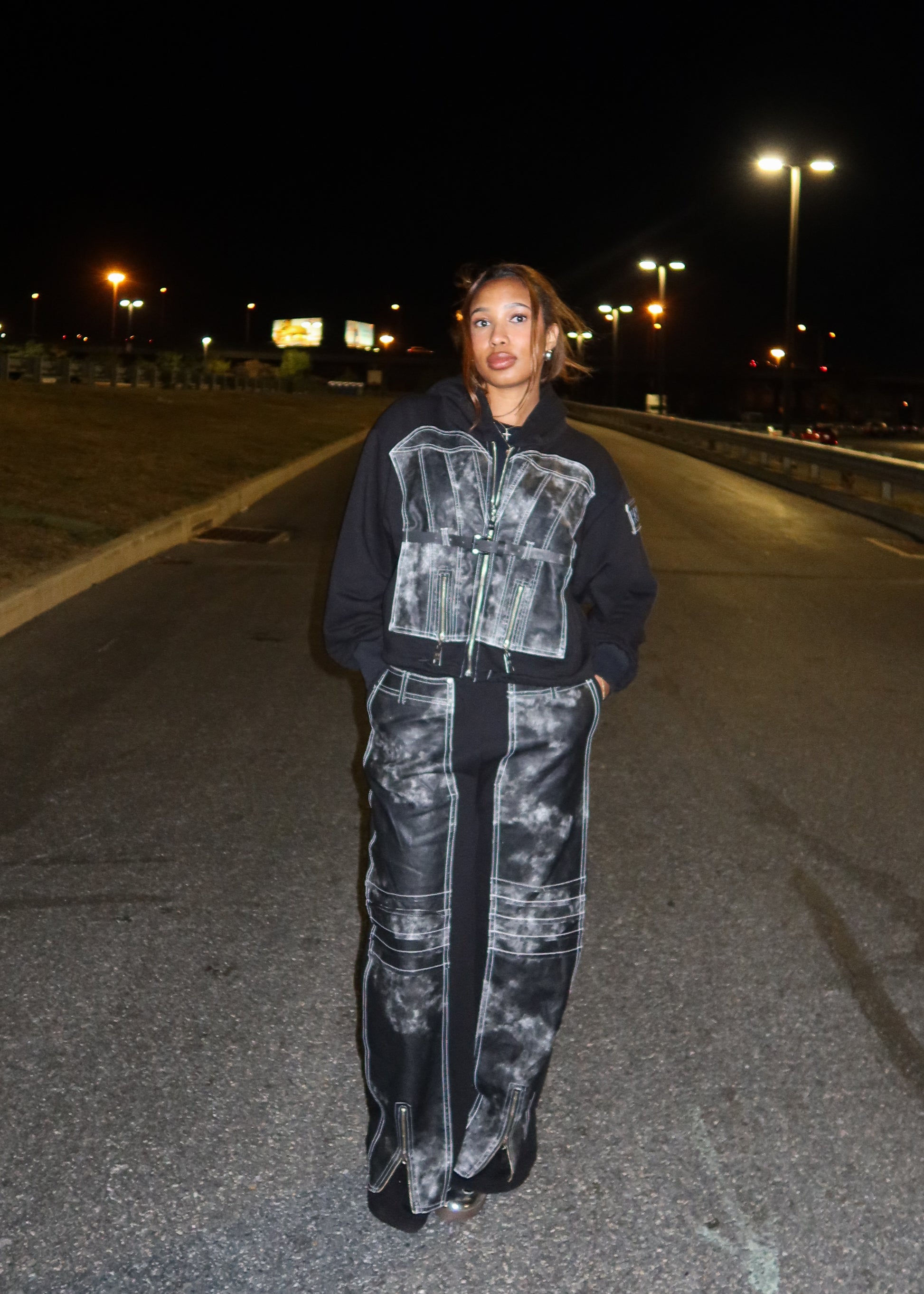 Streetwear statement hoodie
Concert or festival outfit
Edgy urban fashion
Casual-chic evening wear
Weekend street-style look
Fashion-forward nightlife outfit
Edgy street fashion
Retro-futuristic grunge
Statement urban wear
Bold high-fashion denim
Vintage-inspired meets modern
Distressed and deconstructed style