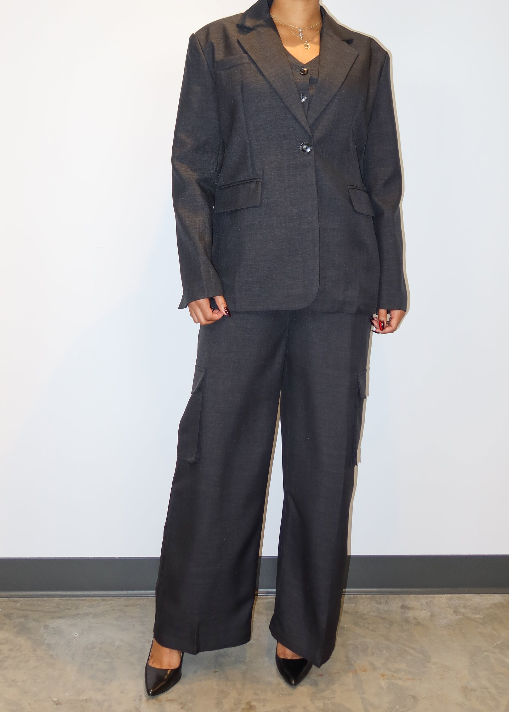 Power dressing for women
Professional workwear outfit
Business formal attire
Boss lady fashion
Corporate chic look
Executive office wear
Smart casual work outfit
Elegant boardroom attire
Stylish job interview suit
High-fashion businesswear
Three-piece women’s suit
Tailored waistcoat set
Wide-leg suit pants
Structured blazer outfit
Cargo pocket trousers
Minimalist black vest suit
Oversized blazer trend
Menswear-inspired fashion
Modern utility suit
Timeless tailored ensemble
Sleek and sophisticated
Confident 