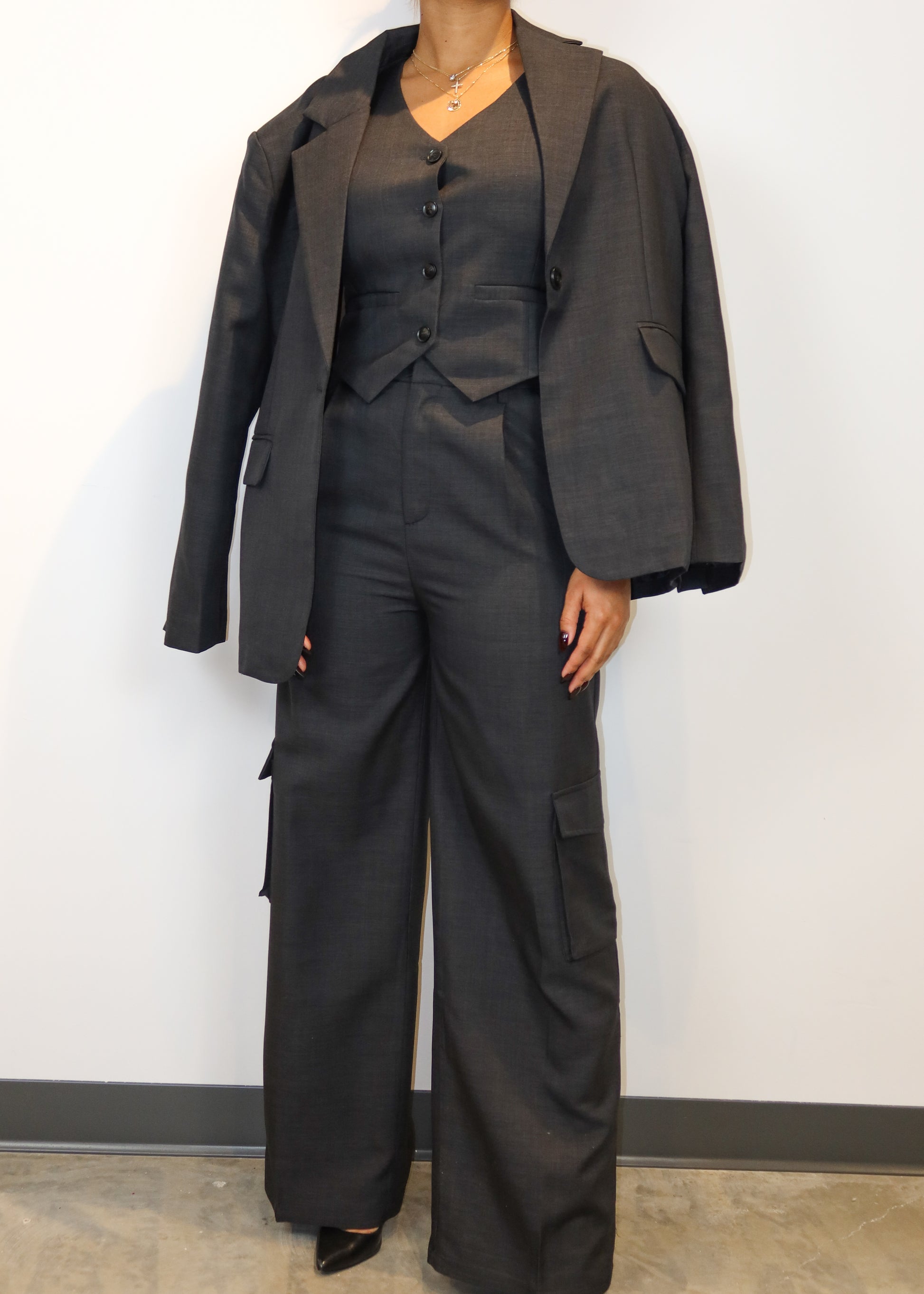 Power dressing for women
Professional workwear outfit
Business formal attire
Boss lady fashion
Corporate chic look
Executive office wear
Smart casual work outfit
Elegant boardroom attire
Stylish job interview suit
High-fashion businesswear
Three-piece women’s suit
Tailored waistcoat set
Wide-leg suit pants
Structured blazer outfit
Cargo pocket trousers
Minimalist black vest suit
Oversized blazer trend
Menswear-inspired fashion
Modern utility suit
Timeless tailored ensemble
Sleek and sophisticated
Confident 