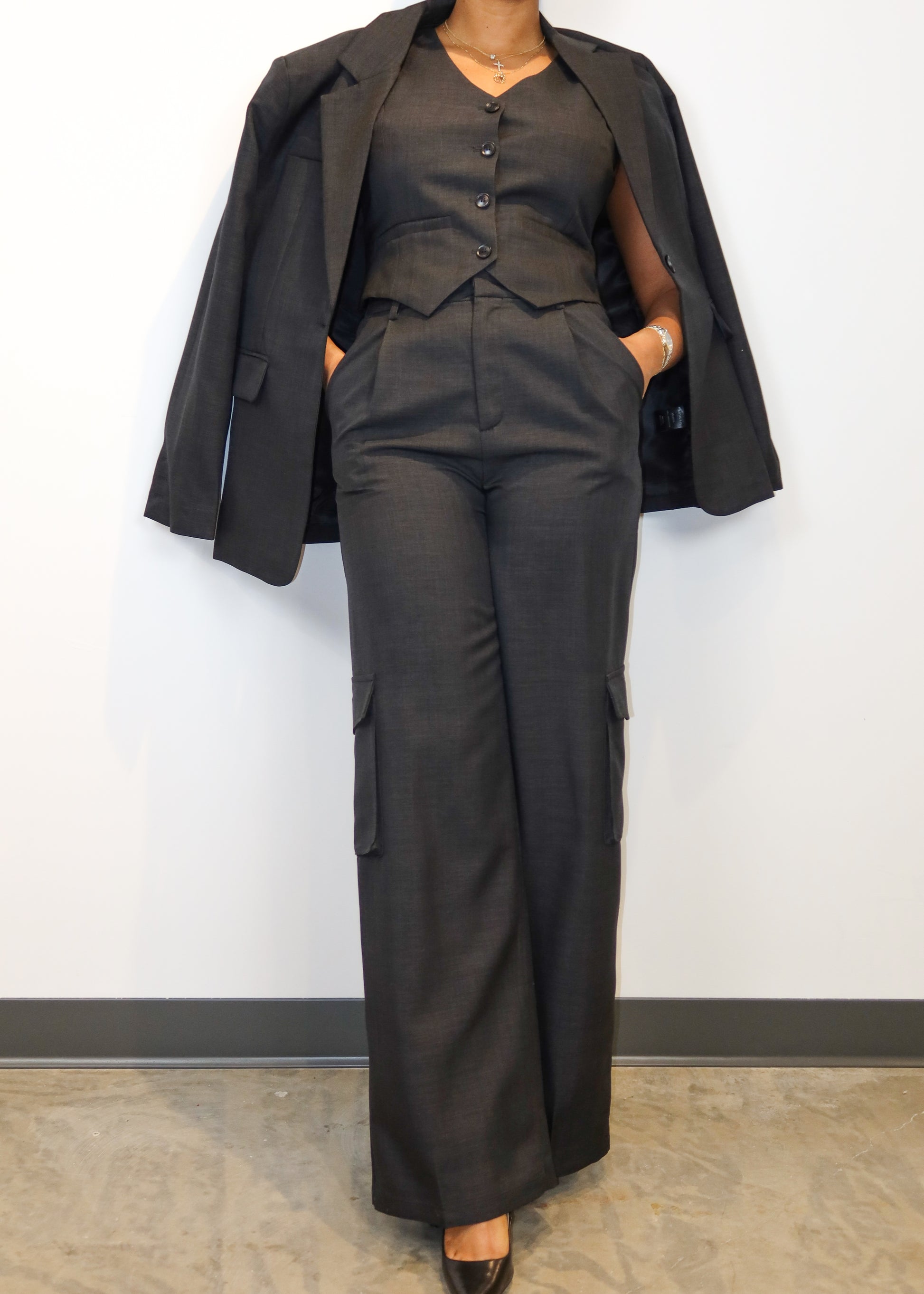 Power dressing for women
Professional workwear outfit
Business formal attire
Boss lady fashion
Corporate chic look
Executive office wear
Smart casual work outfit
Elegant boardroom attire
Stylish job interview suit
High-fashion businesswear
Three-piece women’s suit
Tailored waistcoat set
Wide-leg suit pants
Structured blazer outfit
Cargo pocket trousers
Minimalist black vest suit
Oversized blazer trend
Menswear-inspired fashion
Modern utility suit
Timeless tailored ensemble
Sleek and sophisticated
Confident 