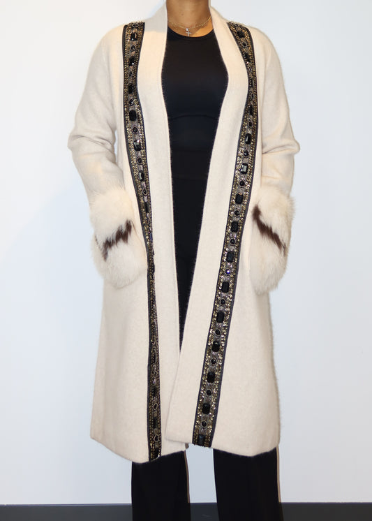 Sophisticated evening outerwear
Winter fashion must-have coat
Red carpet-inspired winter coat
Luxury holiday coat outfit
Formal evening coat for women
intricately beaded trim long coat
Plush wool coat with faux fur accents
Embellished open-front coat design
Vintage-inspired regal winter fashion
Black and white contrast detailing in coats
Elegant winter coat for women
Luxurious embellished longline coat
Statement outerwear with fur cuffs
Timeless chic white coat
Designer-inspired winter fashion