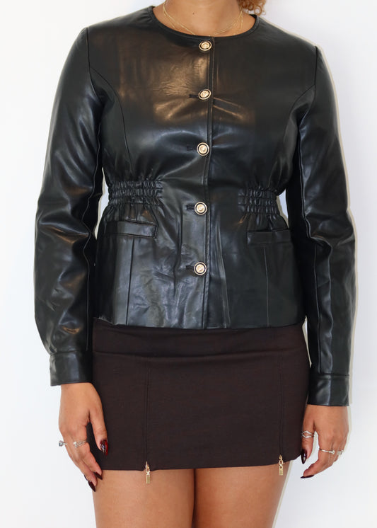 Street-style leather jacket outfit
Day-to-night edgy fashion
Power dressing with a modern twist
Bold and confident fashion
Effortless elegance with leather
Premium faux leather jacket
Classic leather blazer-style jacket
Gold button leather jacket
Waist-cinching leather jacket
Sleek tailored outerwear
Black leather jacket for women
Edgy leather streetwear
Chic button-up leather jacket
Trendy leather outerwear
Minimalist fashion statement