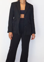 Professional office blazer
Workwear must-have blazer
Smart casual business outfit
Versatile evening blazer
Timeless black suit jacket
Textured panel blazer
Feminine structured blazer
Two-button classic blazer
Statement tailored outerwear
High-fashion black blazer
Classic black blazer for women
Elegant tailored blazer
Power dressing blazer
Business chic formal wear
Structured blazer for work