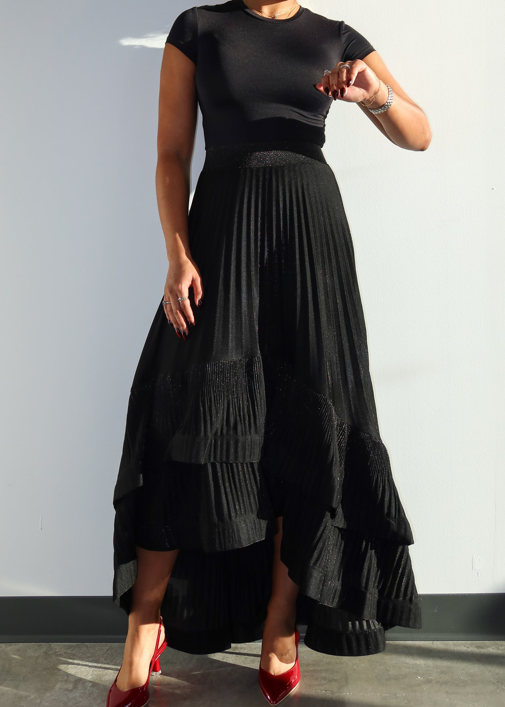 Evening wear skirt
Partywear skirt
Cocktail event skirt
Elegant formal skirt
Date night outfit
Wedding guest skirt
Holiday party fashion
High-low hem skirt
Pleated maxi skirt
Layered ruffle skirt
Flowy asymmetrical skirt
Glitter black skirt
Statement fashion piece
Dramatic silhouette skirt
Chic and sophisticated
Timeless black fashion
Elegant and classy outfit
Feminine and stylish
Contemporary luxury look
Glamorous high-low skirt
Versatile fashion staple