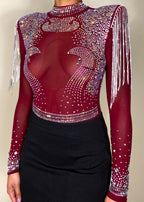 Party outfit
Nightclub fashion
Concert outfit
Festival look
Evening wear
Special occasion attire
Rhinestone-embellished bodysuit
Sheer long sleeve top
High-neck mesh bodysuit
Beaded shoulder details
Statement fringe design
Form-fitting mini skirt
Embellished sheer top
Bold and edgy look
High-fashion aesthetic
Daring and sexy outfit
Statement eveningwear
Eye-catching details
Trendy and bold ensemble