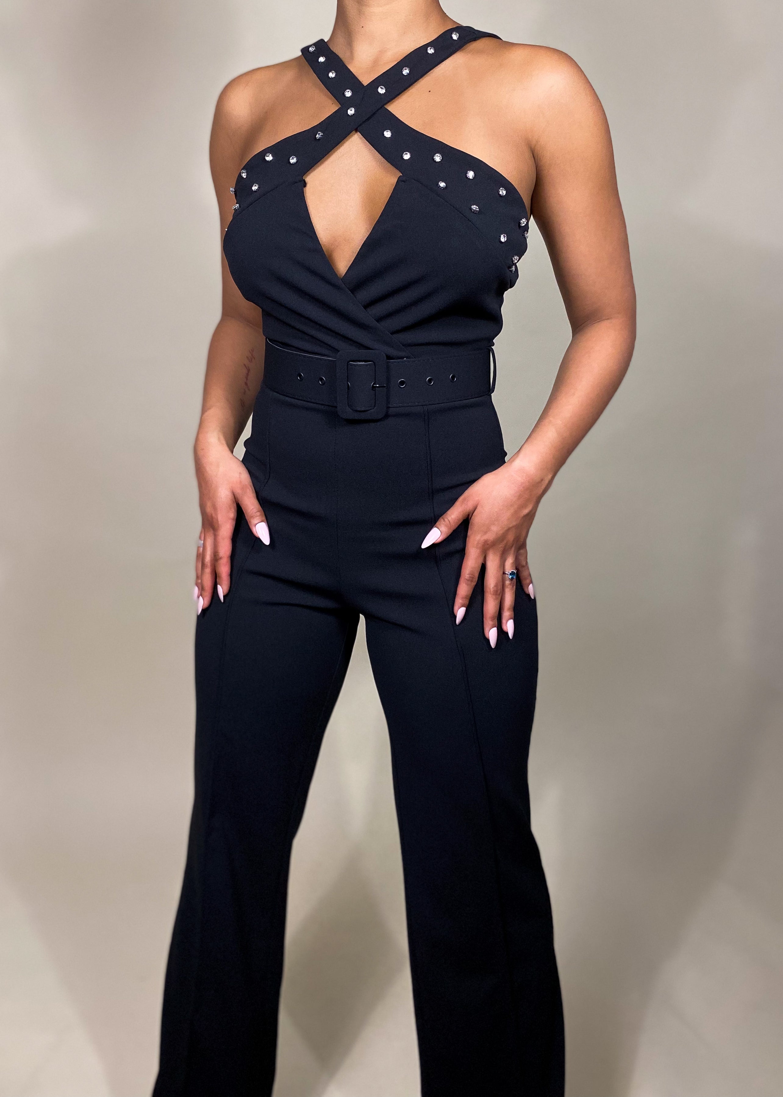 Elegant evening jumpsuit
Cocktail party outfit
Date night fashion
Formal event jumpsuit
Red carpet look
Wedding guest jumpsuit
Stylish partywear
Birthday celebration outfit
Chic clubwear outfit
Black tie event jumpsuit
Studded halter jumpsuit
Cross-neck jumpsuit
Belted waist jumpsuit
Wide-leg jumpsuit
Sleeveless evening jumpsuit
High-waisted jumpsuit
Tailored fit jumpsuit
Statement fashion piece
Luxury fashion jumpsuit
Glamorous black jumpsuit
Modern edgy fashion
Sophisticated yet bold
Sexy yet elegant outf
