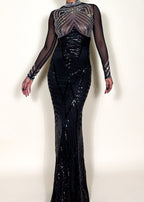 Red carpet black gown
Luxury gala evening dress
Show-stopping award night outfit
High-fashion formal dress
Black-tie statement gown Trending black evening dresses 2025
Celebrity-inspired formal gowns
Statement dresses
Luxe fashion for high-end events
Must-have evening dress 2025
Sheer mesh bodice with rhinestones
Crystal-beaded illusion sleeves
Floor-length mermaid sequin dress
Figure-hugging long evening gown
Intricate beaded couture dress
Black sequin illusion gown
Sheer long-sleeve embellished dress