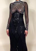 Red carpet black gown
Luxury gala evening dress
Show-stopping award night outfit
High-fashion formal dress
Black-tie statement gown Trending black evening dresses 2025
Celebrity-inspired formal gowns
Statement dresses
Luxe fashion for high-end events
Must-have evening dress 2025
Sheer mesh bodice with rhinestones
Crystal-beaded illusion sleeves
Floor-length mermaid sequin dress
Figure-hugging long evening gown
Intricate beaded couture dress
Black sequin illusion gown
Sheer long-sleeve embellished dress