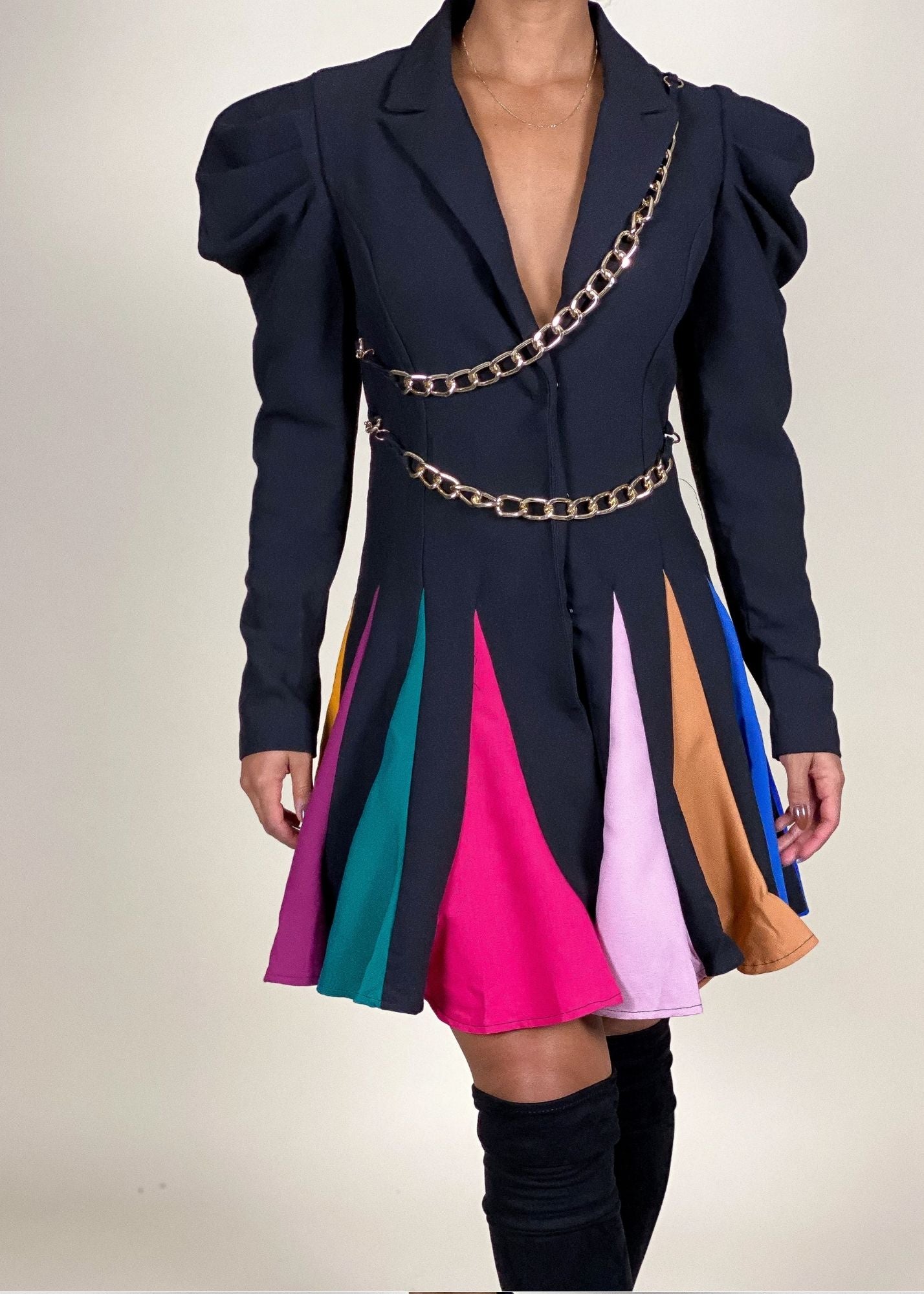 Standout cocktail party outfit
High-fashion runway-inspired look
Evening wear with a contemporary twist
Eye-catching designer-style mini dress
Power dressing with a modern edge
Puff sleeve blazer mini dress
Pleated multicolor contrast skirt
Chic chain belt detailing
Feminine meets edgy structured dress
statement piece
Edgy blazer dress with color-blocking
Modern power dress with gold chains
Unique asymmetrical mini dress
Bold structured blazer-inspired dress
Trendy fashion-forward statement dress