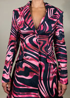 Power dressing statement look
High-fashion night out outfit
Elegant yet bold gala outfit
Fall/Winter luxury coat dress
Runway-inspired eveningwear
Tailored satin longline blazer
Double-breasted structured dress
High-low hemline statement coat
Black patent corset belt detail
Swirl print power dressing pieceEdgy satin blazer dress
Abstract swirl print coat dress
High-low structured blazer dress
Bold belted trench-inspired dress
Luxe avant-garde fashion