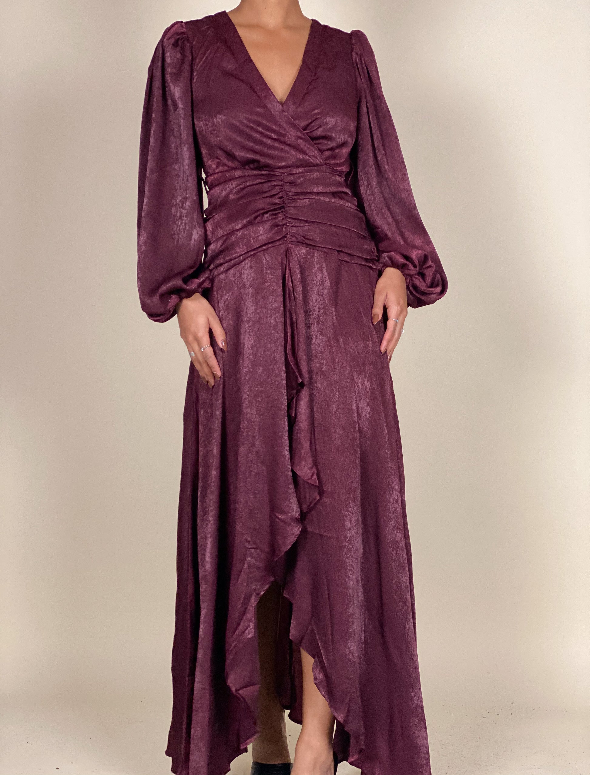 Sophisticated formal evening dress
Fall wedding guest maxi dress
Timeless gala wrap dress
Elegant holiday party outfit
Chic dinner date night gown
Draped V-neck satin dress
Statement sleeve formal gown
Soft shimmering wrap maxi dress
Flowing high-low ruffle dress
Belted waist luxury evening wear
Deep plum satin wrap dress
Long-sleeve belted evening gown
Luxe ruched maxi dress
Vintage-inspired high-slit dress
Elegant ruffle-hem satin dress