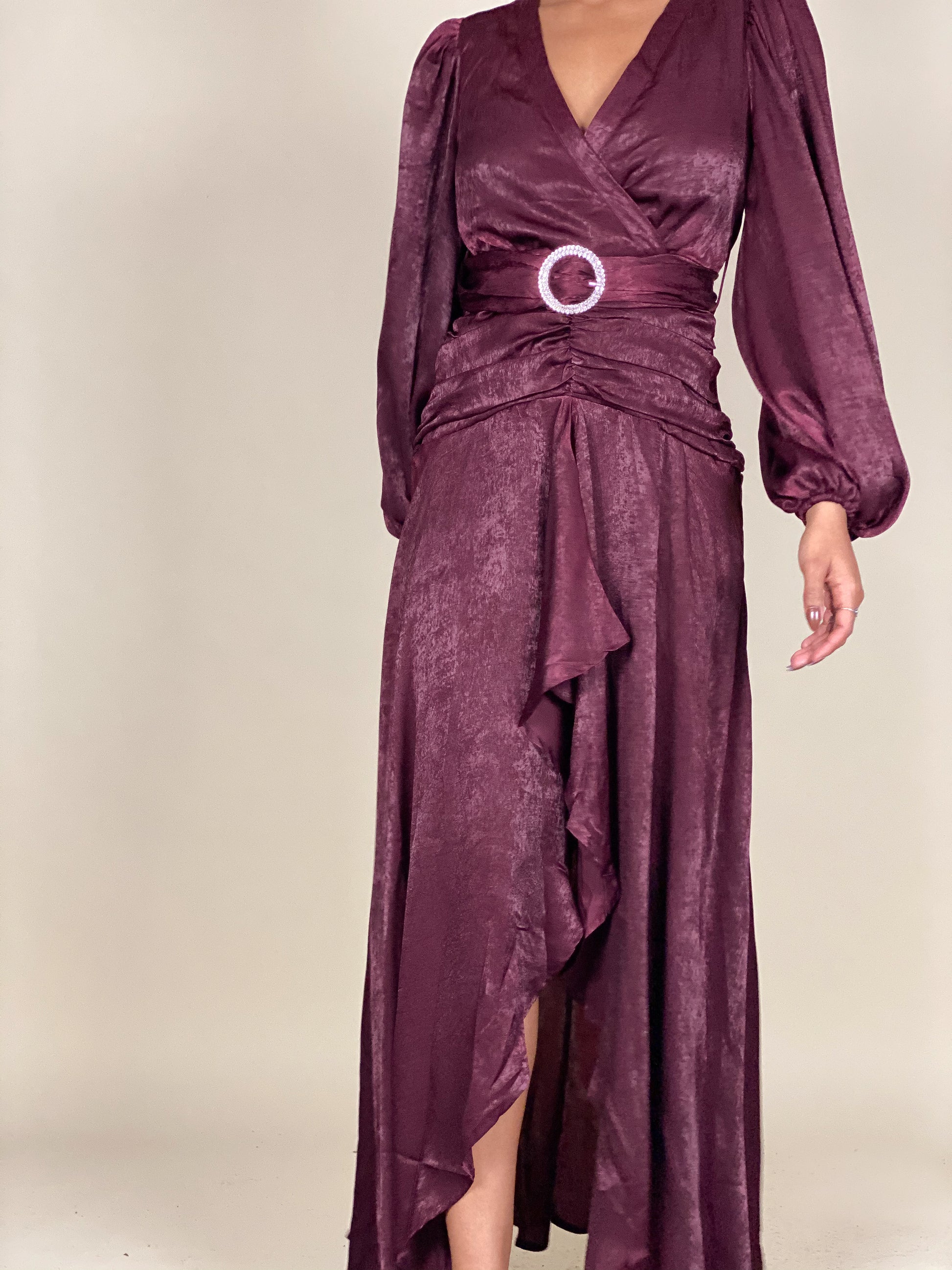 Sophisticated formal evening dress
Fall wedding guest maxi dress
Timeless gala wrap dress
Elegant holiday party outfit
Chic dinner date night gown
Draped V-neck satin dress
Statement sleeve formal gown
Soft shimmering wrap maxi dress
Flowing high-low ruffle dress
Belted waist luxury evening wear
Deep plum satin wrap dress
Long-sleeve belted evening gown
Luxe ruched maxi dress
Vintage-inspired high-slit dress
Elegant ruffle-hem satin dress