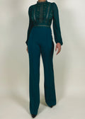 Wedding guest outfit idea
Office-to-evening transition look
Formal jumpsuit for special occasions
Elegant workwear for women
Statement outfit for upscale events
Sheer lace bodice with high neckline
Long puffed sleeves with delicate finish
High-waisted flared pants
Structured yet flowy jumpsuit
Tailored fit with feminine lace accents
Elegant teal jumpsuit
Chic one-piece outfit for women
Sophisticated evening wear
Lace detail jumpsuit
Timeless fashion statement