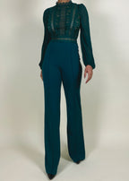Wedding guest outfit idea
Office-to-evening transition look
Formal jumpsuit for special occasions
Elegant workwear for women
Statement outfit for upscale events
Sheer lace bodice with high neckline
Long puffed sleeves with delicate finish
High-waisted flared pants
Structured yet flowy jumpsuit
Tailored fit with feminine lace accents
Elegant teal jumpsuit
Chic one-piece outfit for women
Sophisticated evening wear
Lace detail jumpsuit
Timeless fashion statement